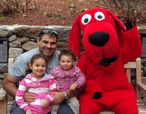 Family of three with clifford in the Children's Garden
