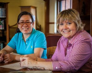 Two women smiling.