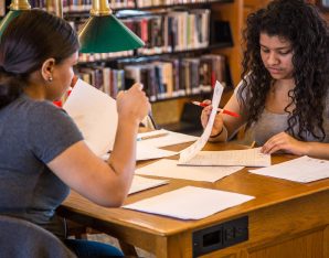 A picture of two girls working.