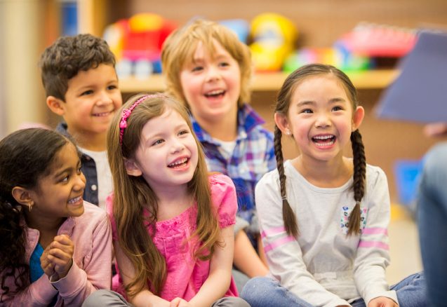 A picture of some children smiling.