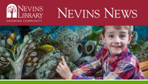 A picture of a child and a fish tank.