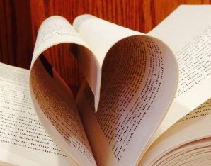 A picture of a book modeled into a heart.