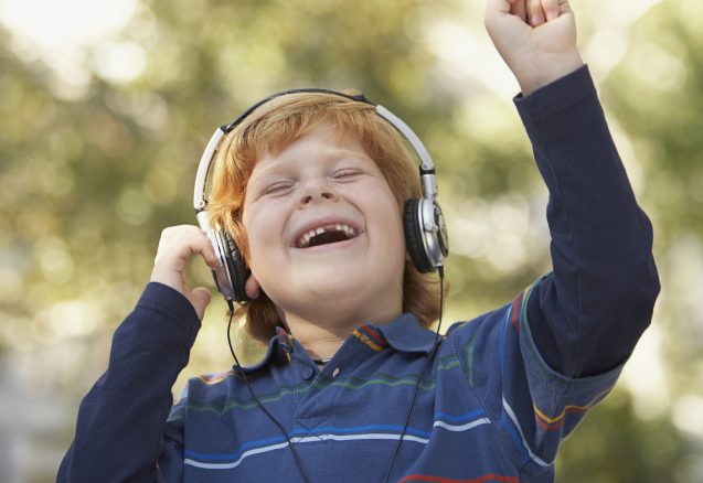 A picture of a kid with headphones on.