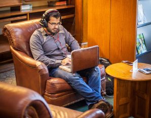 A picture of a man on laptop.