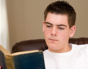 A picture of a boy reading.