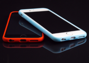 Red Covered Cell Phone and White Colored Cell Phone