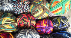 Multi-colored balls of yarn in a pile