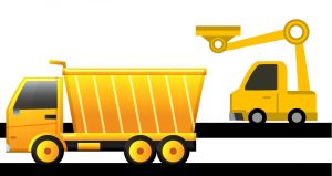 A weird yellow truck about to dump something into a yellow dump truck