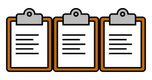 Three brown clipboards in a row with white paper and black lines on them