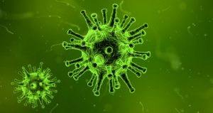 Two green colored viruses with things sticking out from them floating in a greenish ooze like soup