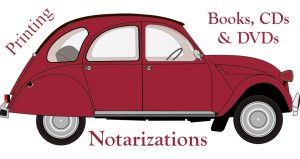 Red Volkswagen Bug with the words Printing at the back, Books CDs and DVDs over its hood and Notarizations under it