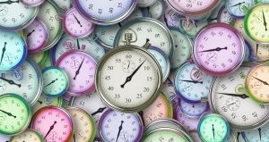 Pile of multicolored stopwatches all facing different directions with different amounts of time on them