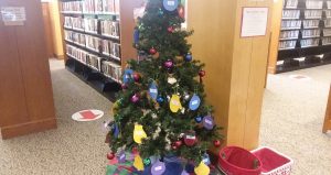 Christmas Tree with real ornaments and paper mittens and ornaments on it