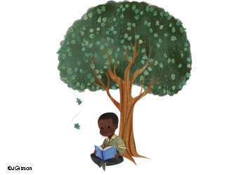 Dark skinned boy reading a blue book under a full green leafed tree with two leaves dropping to the ground