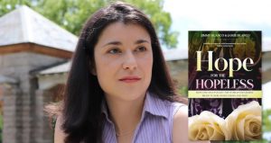 Picture of a light skinned woman with brown hair in a lavender staring into the middle distance. With the cover of Hope for the Hopeless by Jamie and Jimmy Blanco