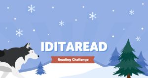 A black and white sled dog and a pine tree on a blue snowy sky background and snowy hill with the words Iditaread Reading Challenge in the middle