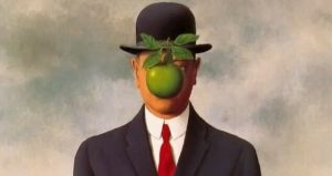 Painting done by Rene Margritte of Man standing in a suit with a green apple where his face should be