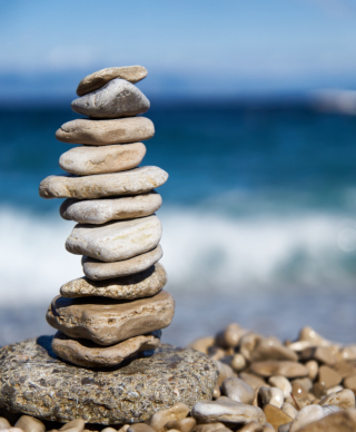 Pile of rocks with crashing waves in the background