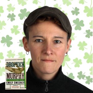 Light skinned woman with short hair in hat next to book Dropkick Murphy