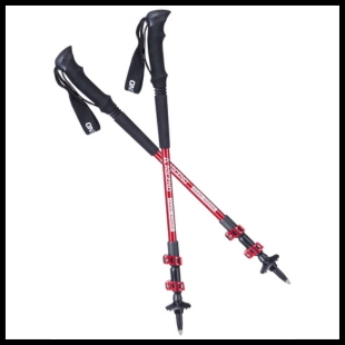 Two red and black hiking poles crossed in an 's' shape