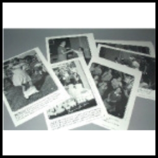 Black and white photos scattered on a table