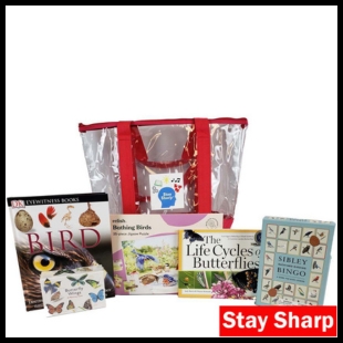 A red and clear bag with bird and butterfly books in front of it with the words Stay Sharp in the bottom right corner
