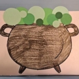 Drawing of a brown caldron with green stuff bubbling up