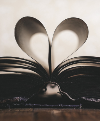 Book with pages arranged to create a heart