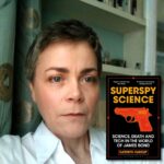 Light skinned brunette female in a white collared shirt with an inset picture of the book "Superspy Science" to her right