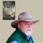 Light skinned man with a white goatee and tan cowboy hat with the book cover of Captain Kidd by Samuel Marquis set off to the upper left