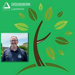 Stylized brown and green tree logo next to a picture of a light skinned male in a blue shirt