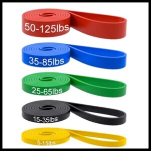 Red, blue, green, black, and yellow resistance bands with varying weights on them in pounds