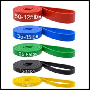 Red, blue, green, black, and yellow resistance bands with varying weights on them in pounds