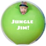 Jungle Jim 315 Light skinned man's head in a hat visible above a squishy green human sized ball