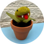 Teen Pop Up Art School 315 Mini Audrey Two venus flytrap made out of felt in a orange pot