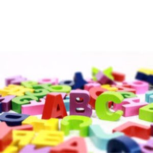 Colorful letters lying on a white table and the letters A, B, and C standing up