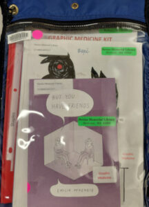 Blue kit bag with But you have friends book at the front and words graphic medicine kit above